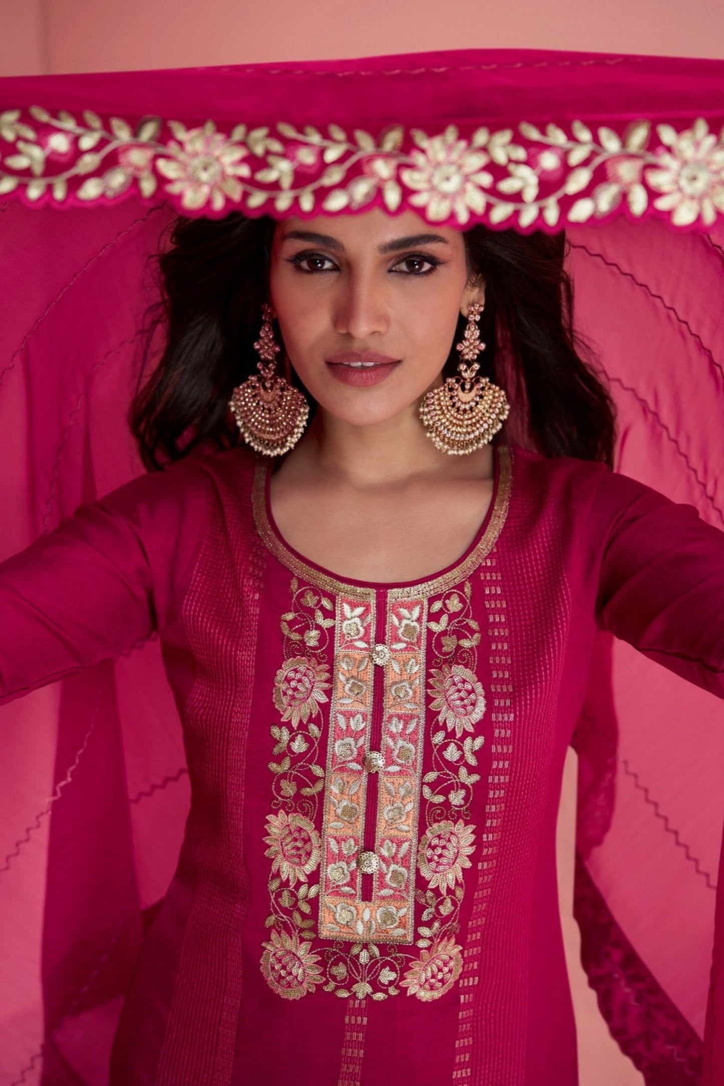Pink salwar kameez is cheerful and lovely. Perfect for celebrations.