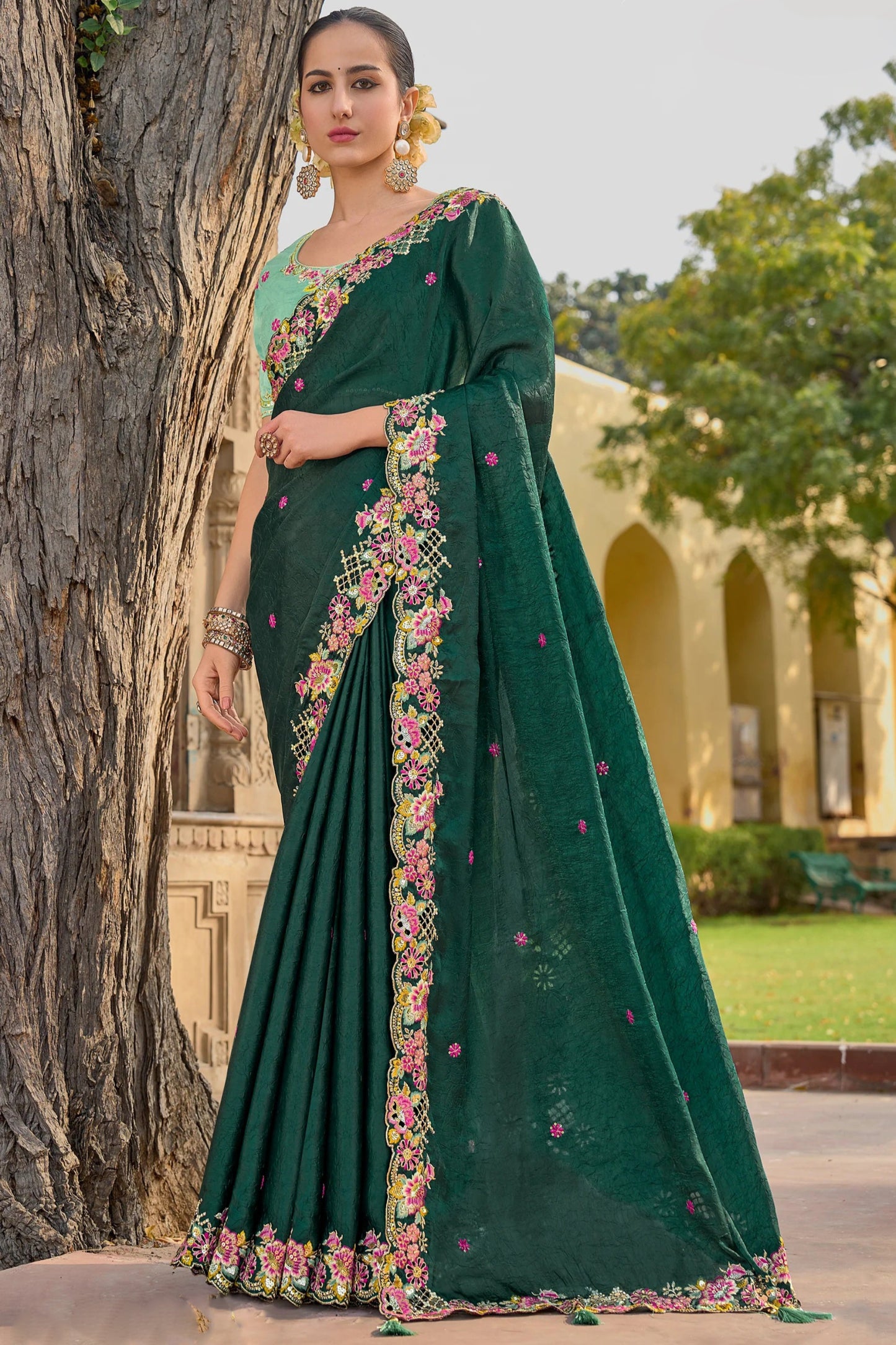 Green Saree symbolizes freshness and festivity – great for Mehndi or family gatherings.