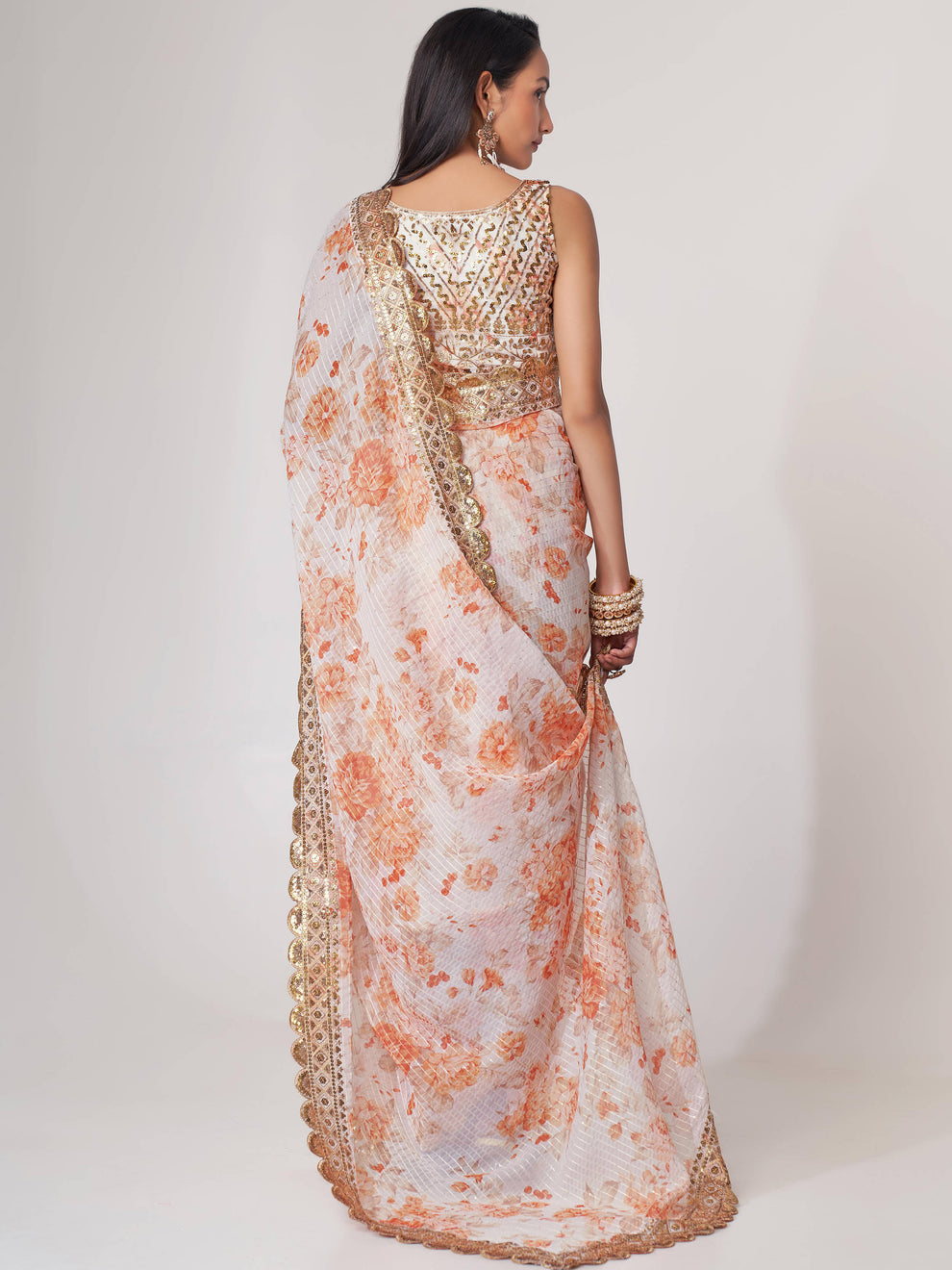 White Saree stands for purity and class – ideal for serene and sacred events.
