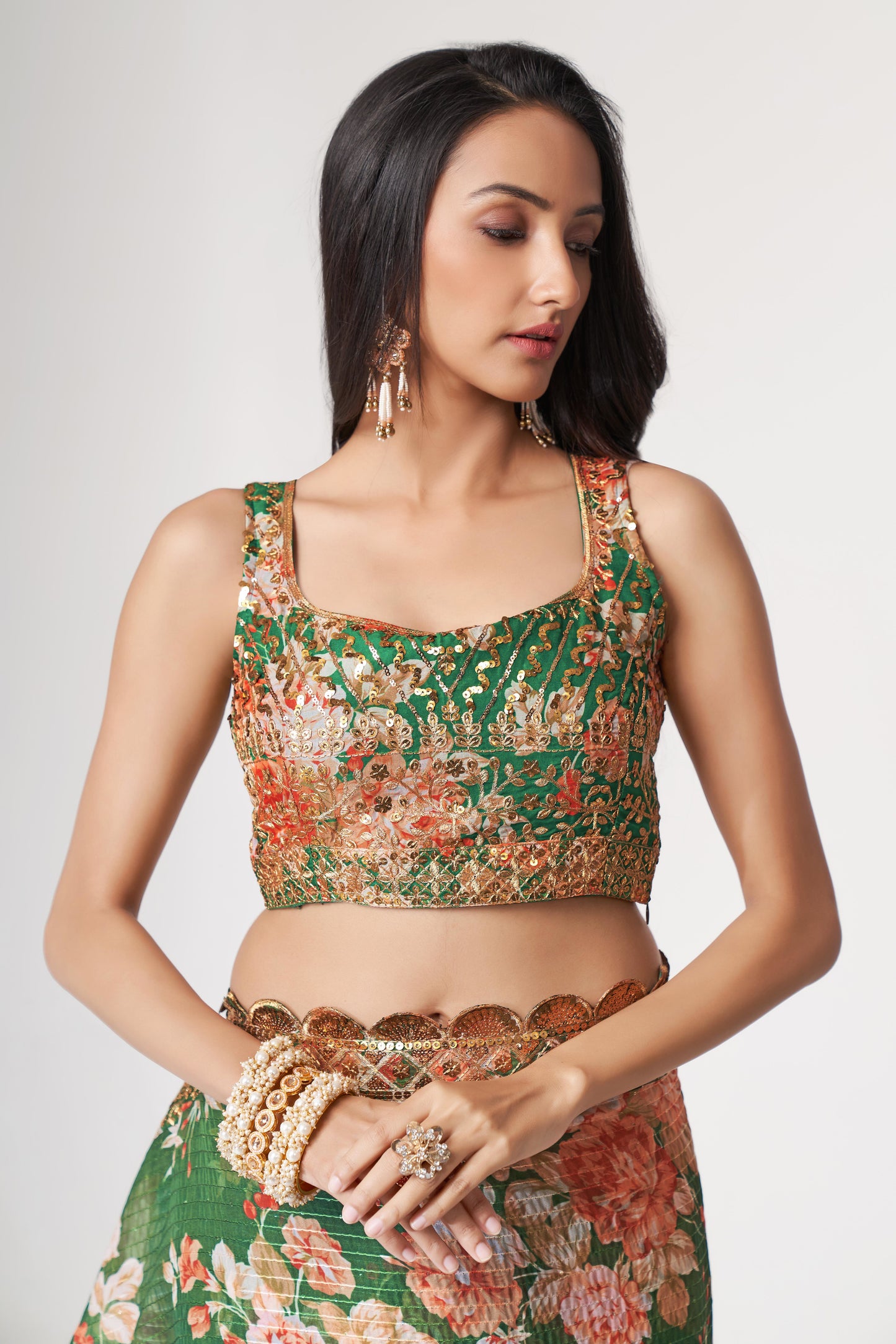 Green Saree symbolizes freshness and festivity – great for Mehndi or family gatherings.