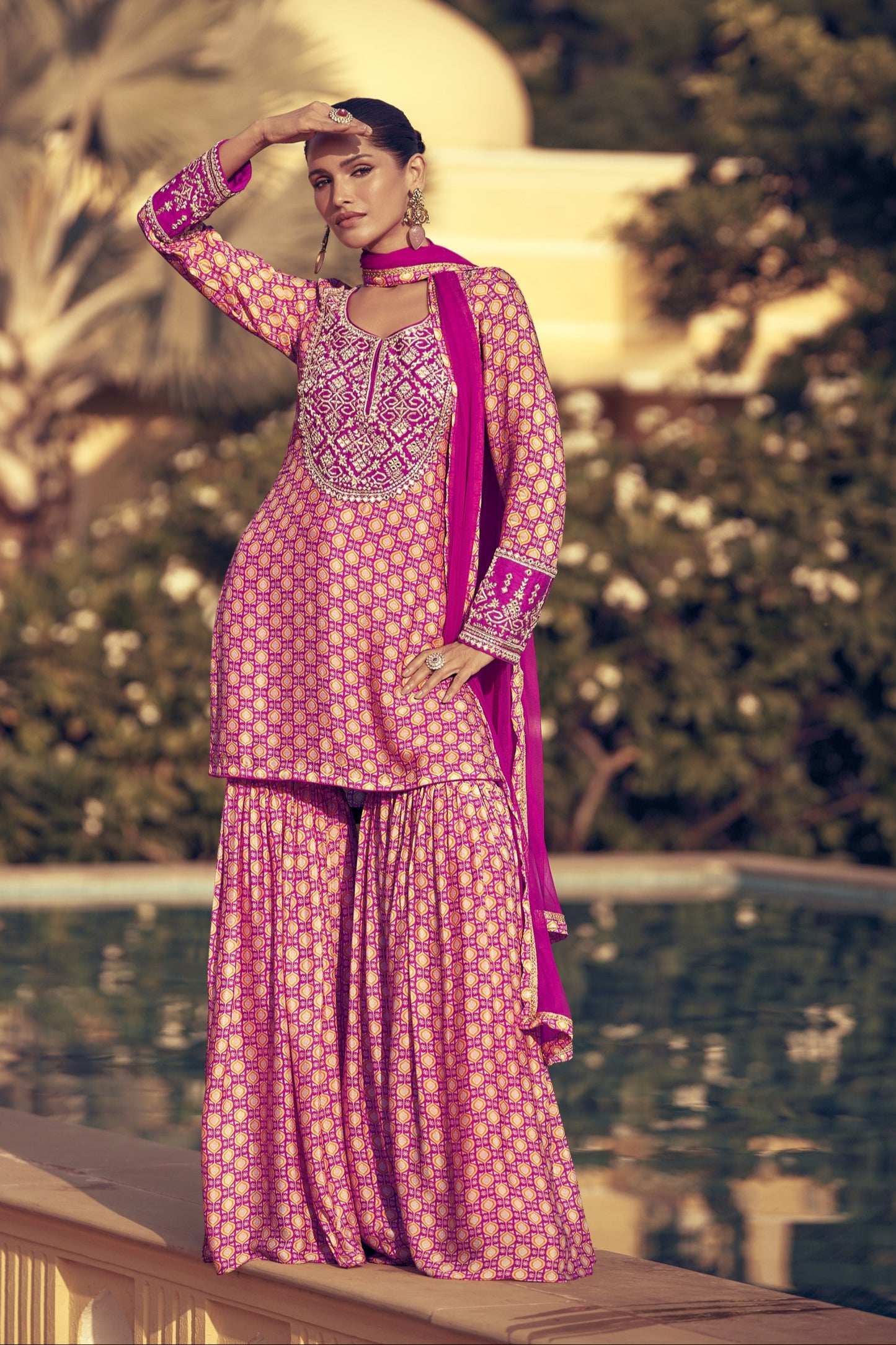 Light pink color sharara suit in Chinon silk fabric with delicate embroidery work, perfect for a graceful and festive ethnic look.