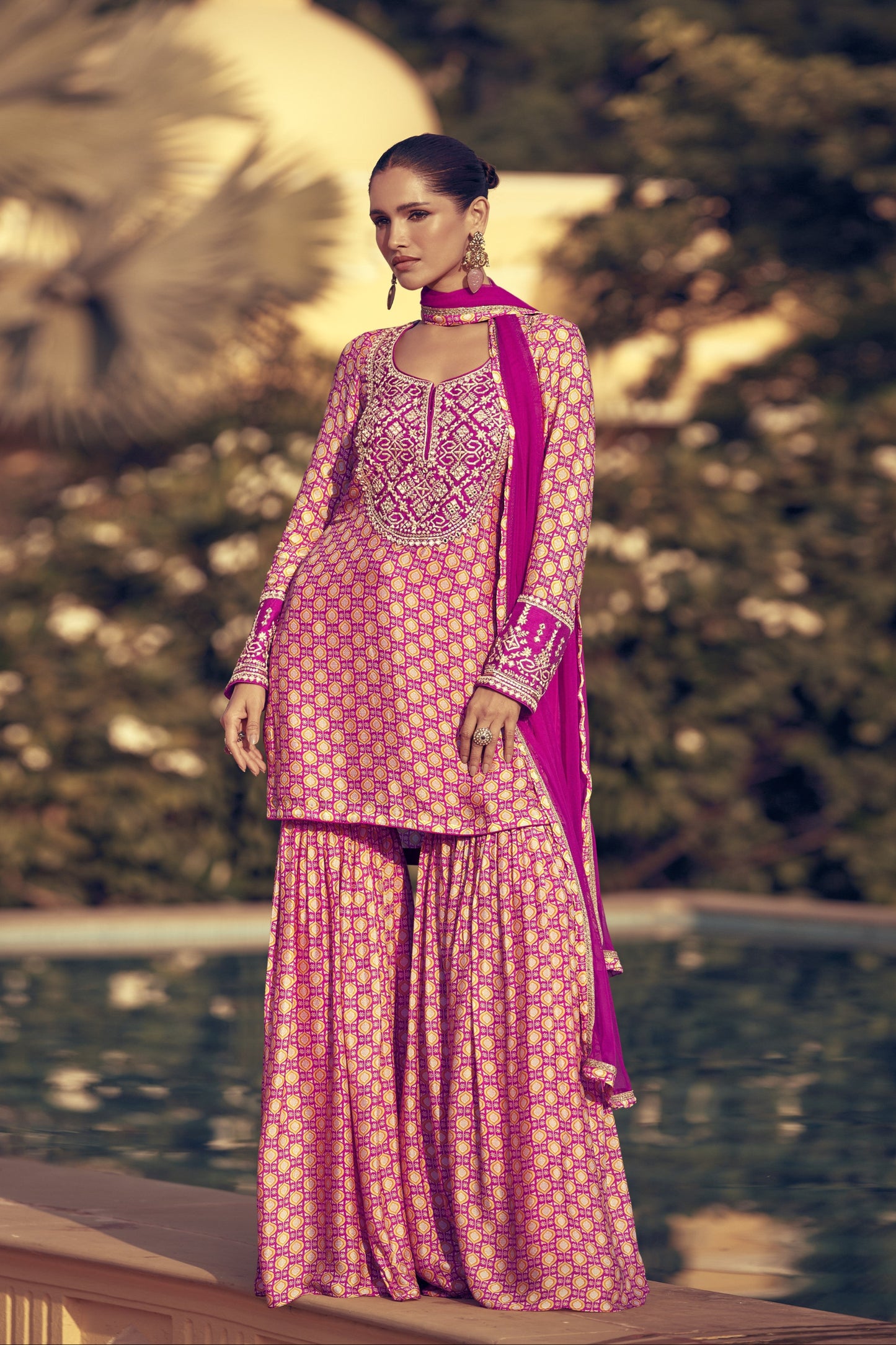 Light pink color sharara suit in Chinon silk fabric with delicate embroidery work, perfect for a graceful and festive ethnic look.
