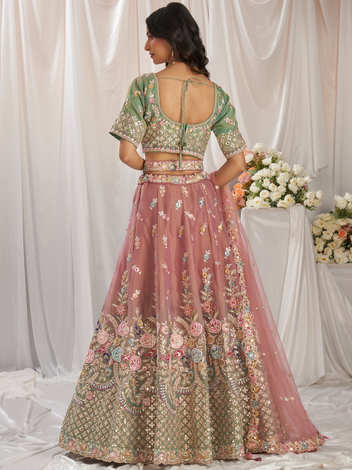 Pink bridal silk lehenga with mirror work luxury design