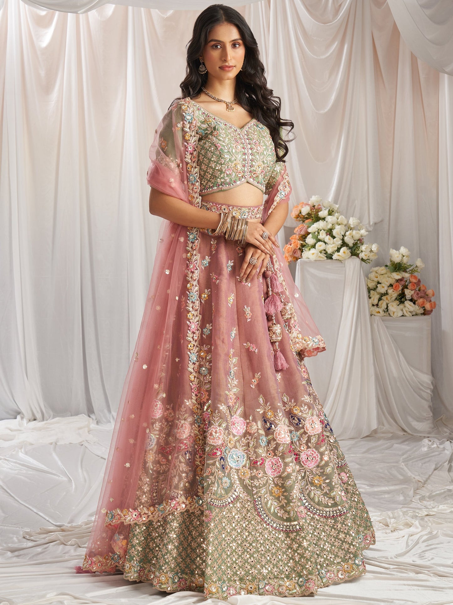 Pink bridal silk lehenga with mirror work luxury design