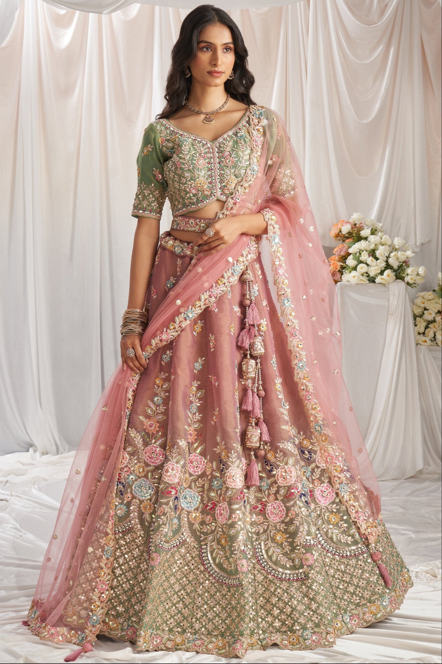 Pink bridal silk lehenga with mirror work luxury design