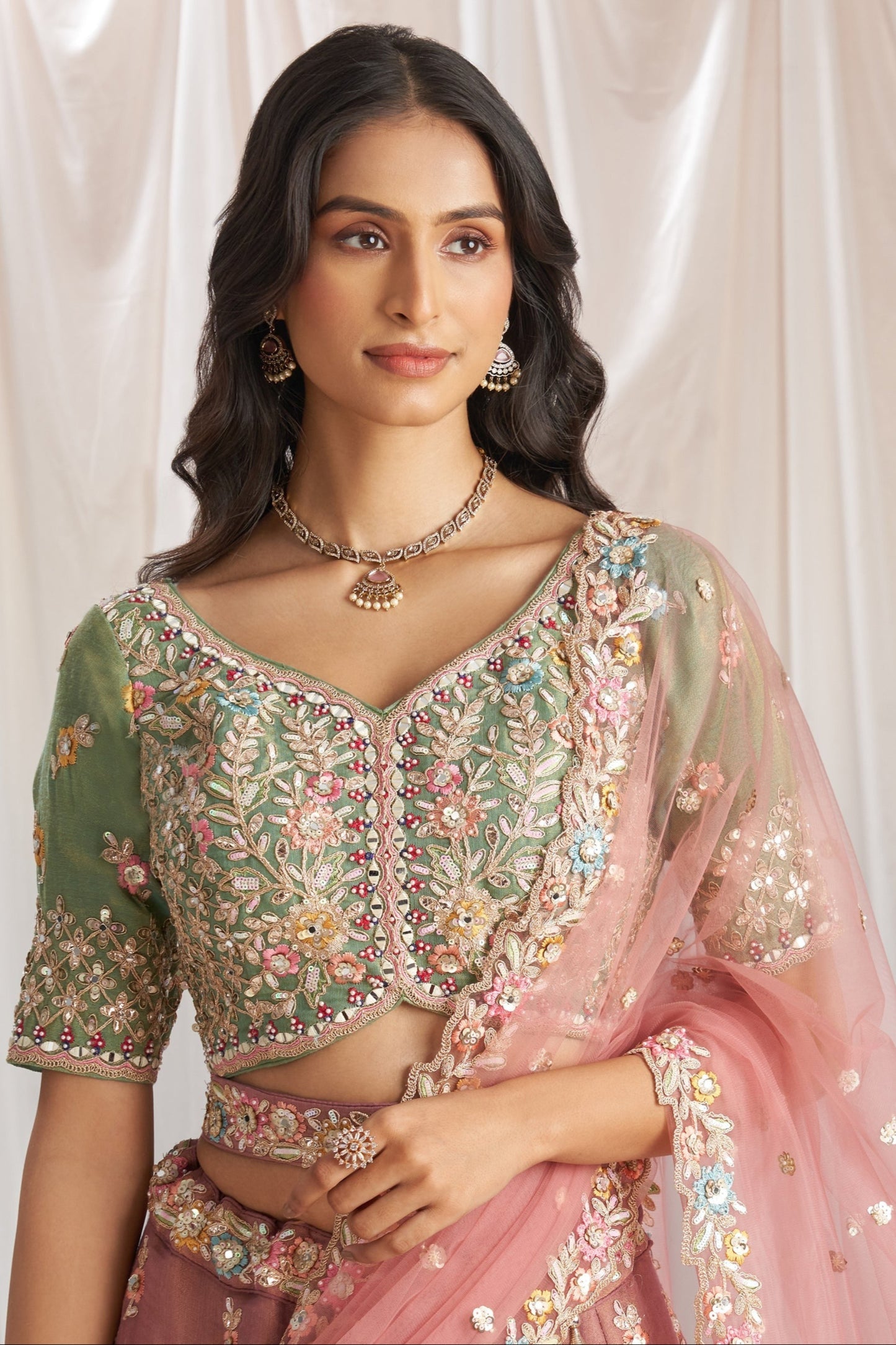 Pink bridal silk lehenga with mirror work luxury design
