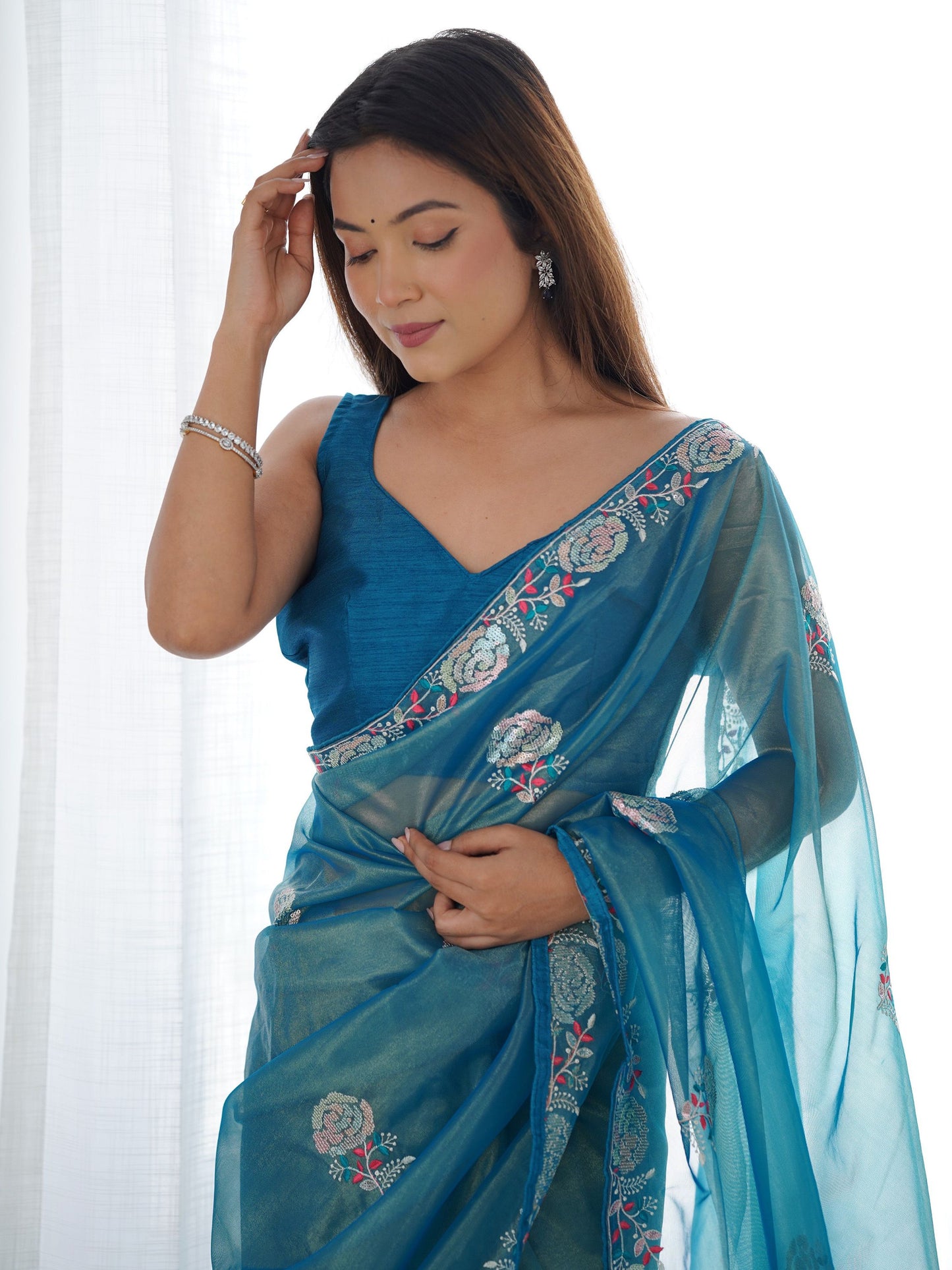 Stunning sky blue silk saree with embroidery for traditional wear.