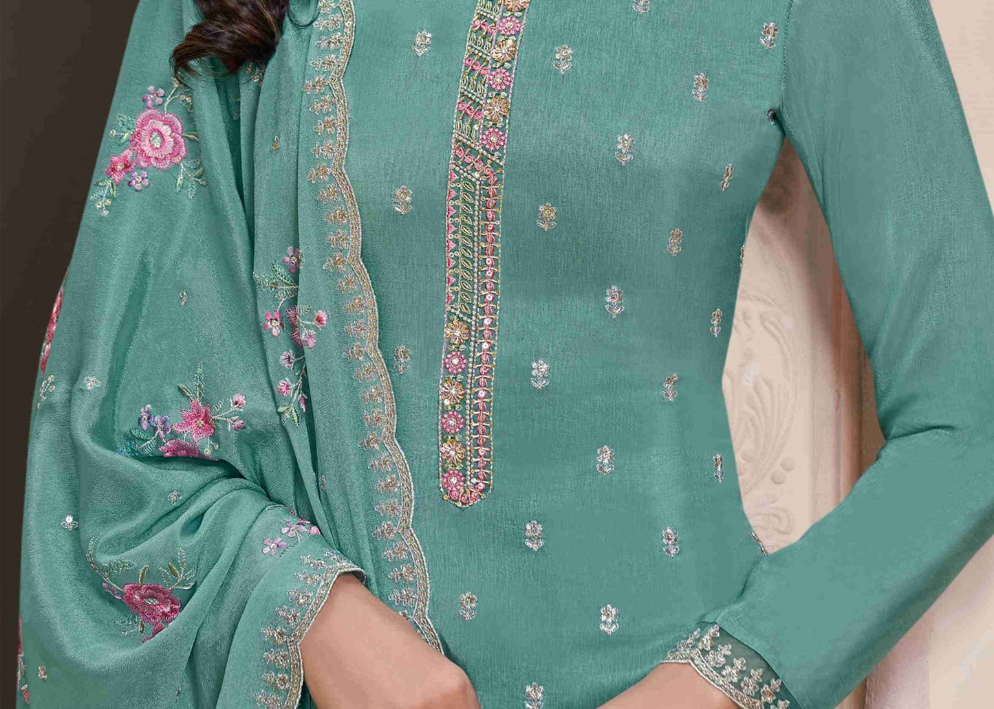 Teal salwar kameez is cool and refreshing. It blends blue and green for a unique look