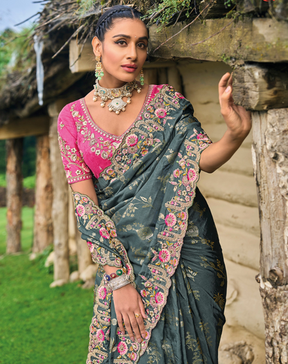 Stunning grey dola silk saree with embroidery—ideal for weddings.