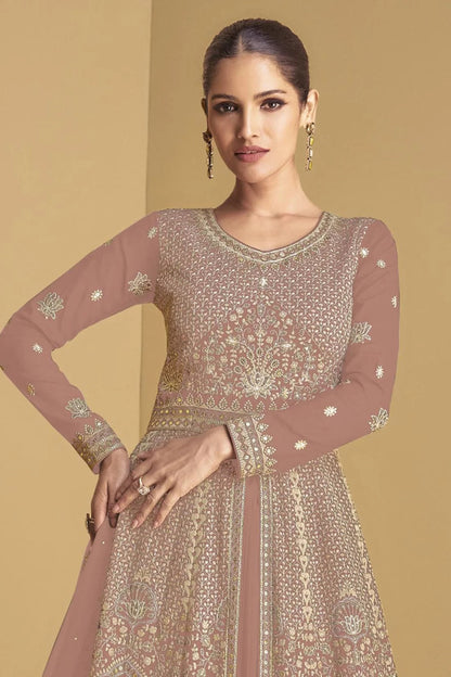 A Woman Modeling Peach Anarkali Gown With Embroidery Worked