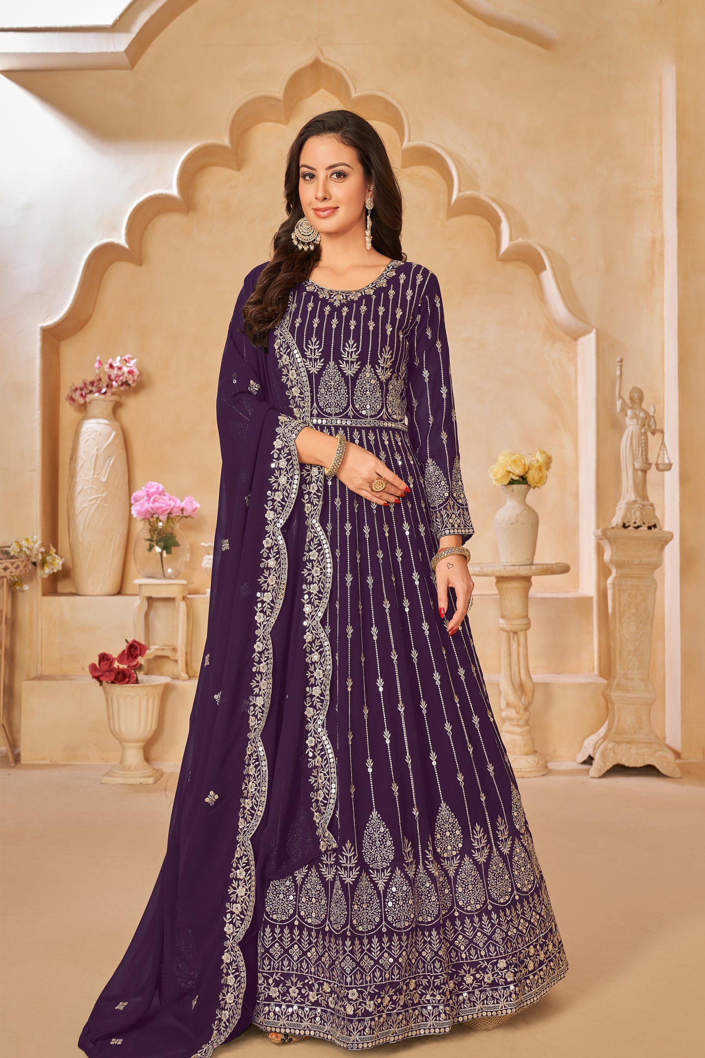 A Woman Modeling Purple Anarkali Dupatta Gown Suit With Embroidery Work