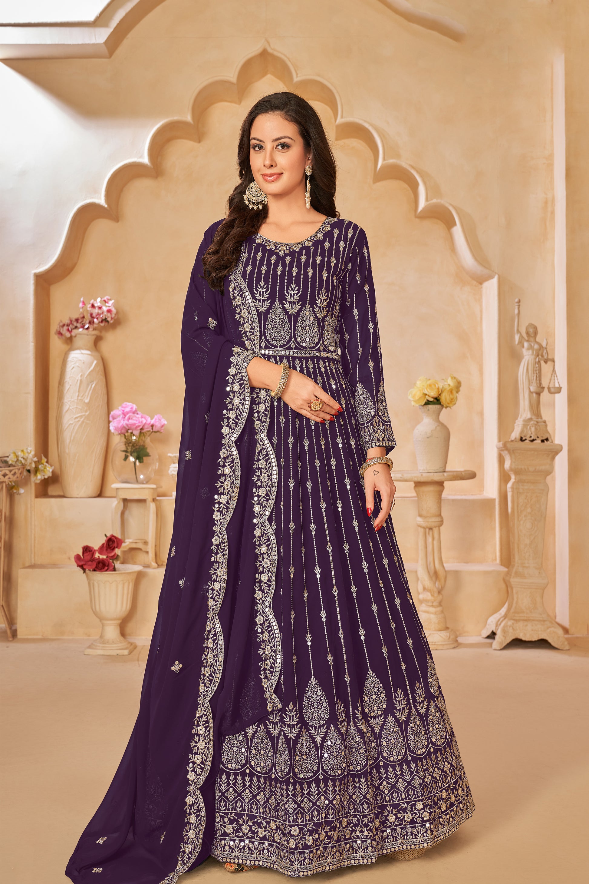 A Woman Modeling Purple Anarkali Dupatta Gown Suit With Embroidery Work