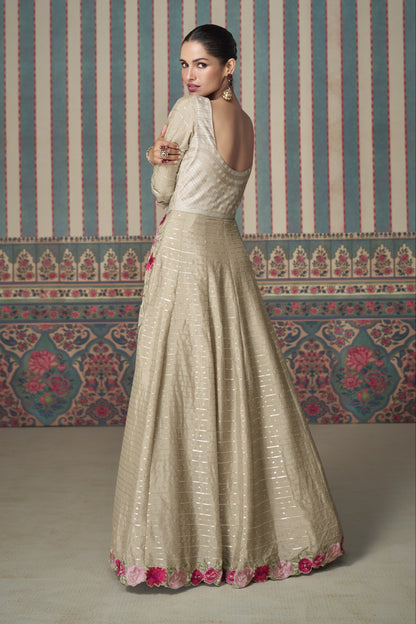 Beige Anarkali gown in Chinon silk with embroidery work, offering a soft, elegant look perfect for festive and special occasions.
