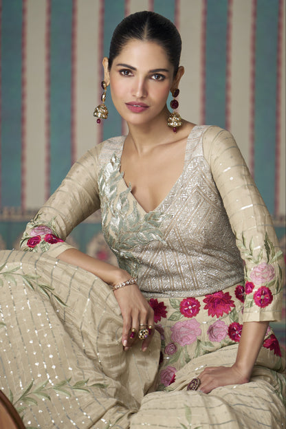 Beige Anarkali gown in Chinon silk with embroidery work, offering a soft, elegant look perfect for festive and special occasions.
