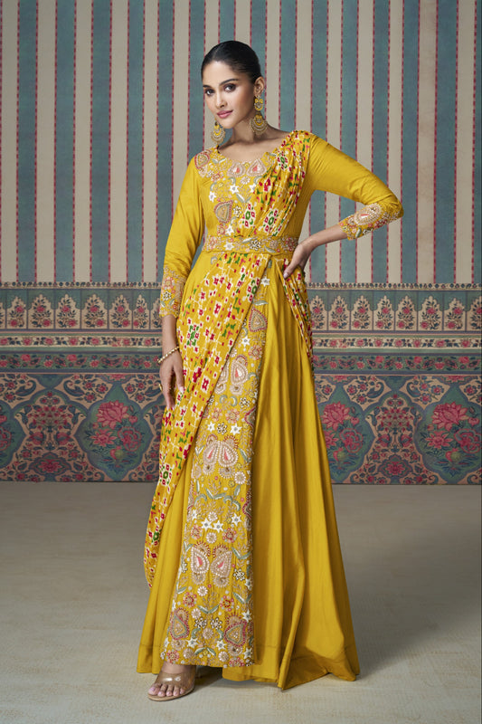 Yellow Anarkali gown in Chinon silk with embroidery work, bringing a bright and graceful charm to festive celebrations.

