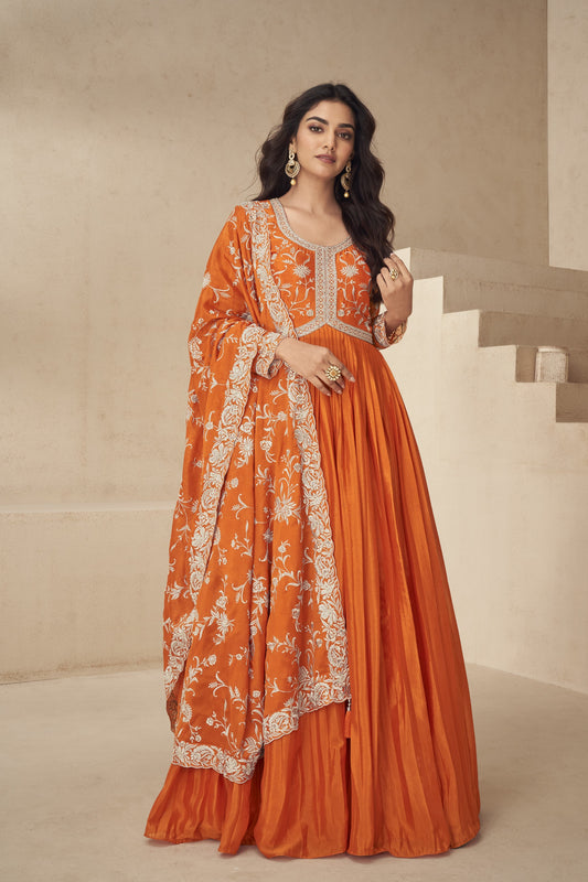Bright orange gown with a festive flair, ideal for haldi ceremonies, daytime events, and cultural celebrations.
