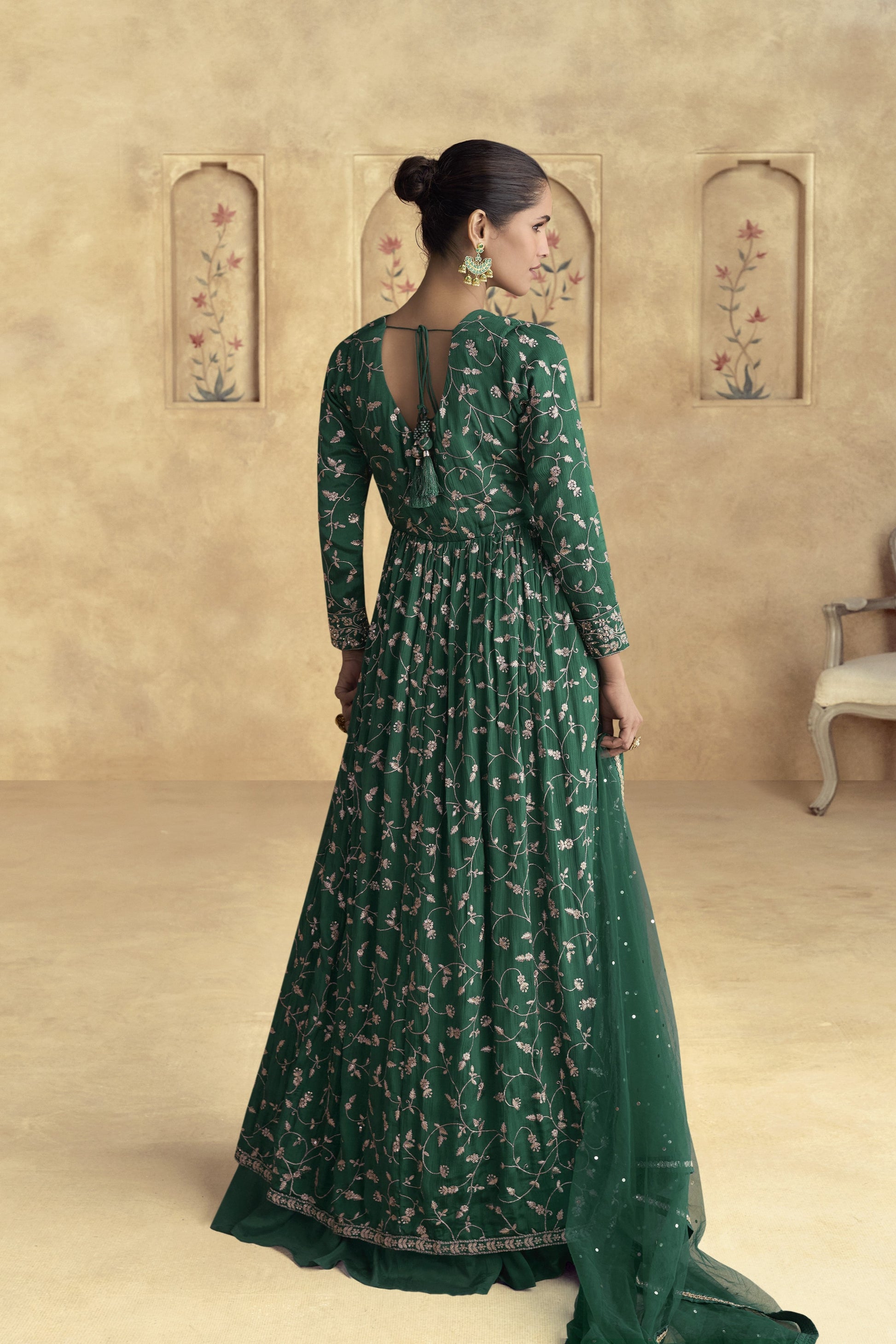 Dark green Anarkali gown with a regal and elegant look, perfect for mehndi functions, evening parties, and traditional celebrations.
