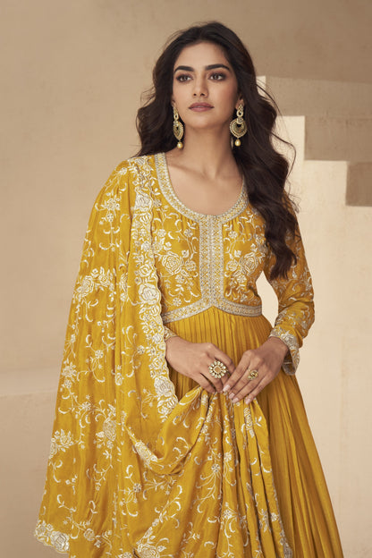 Vibrant yellow gown with elegant detailing, perfect for haldi functions, festive events, and summer celebrations.

