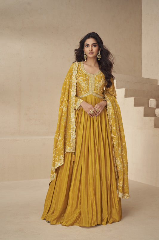 Vibrant yellow gown with elegant detailing, perfect for haldi functions, festive events, and summer celebrations.
