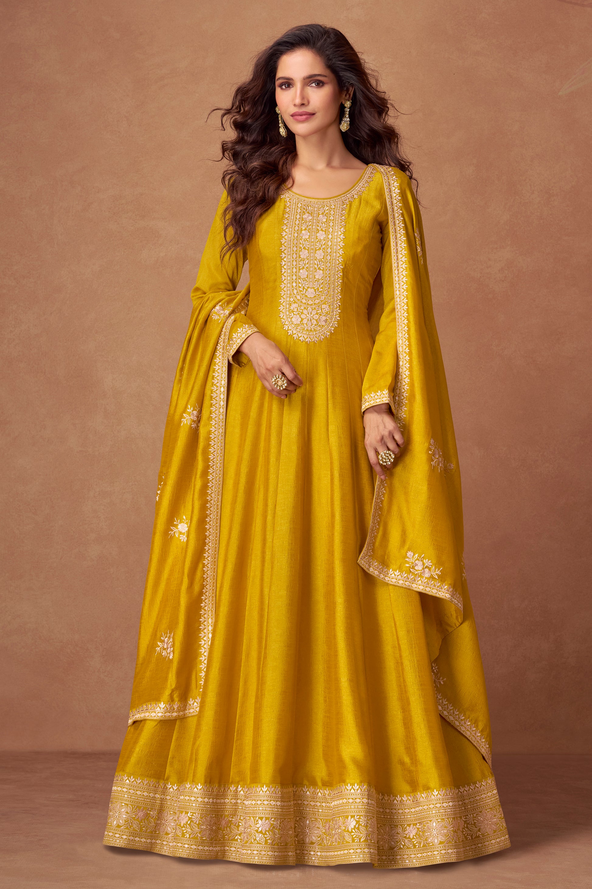 Yellow color Anarkali gown radiates warmth and charm, ideal for Haldi functions, daytime events, and festive occasions.
