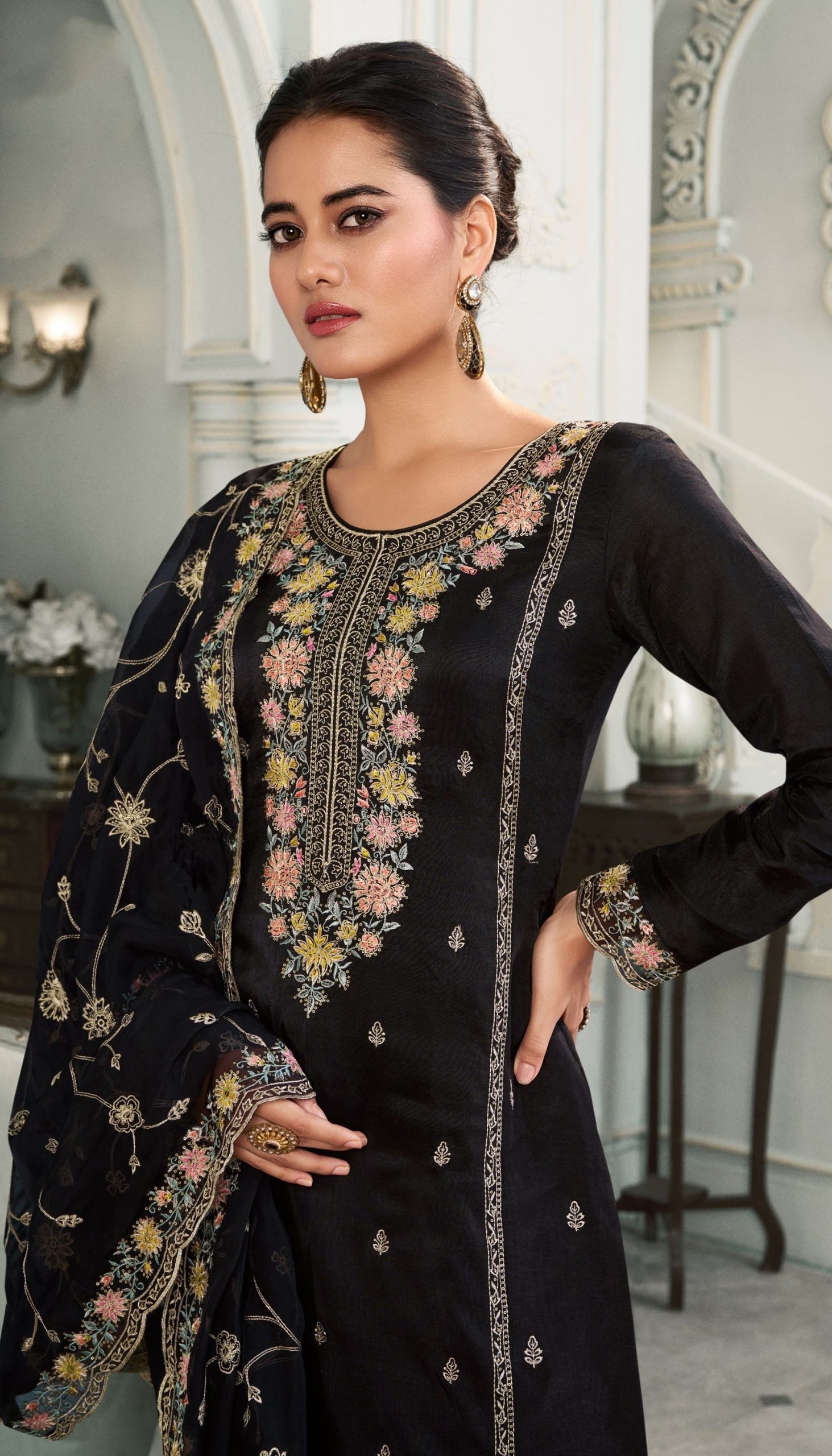 Elegant Black Salwar Suit Featuring Detailed Embroidery And Organza Dupatta For Festive Or Party Wear.