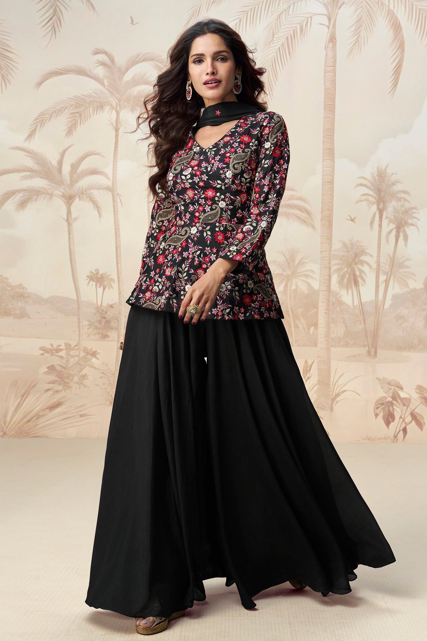 Classic black palazzo outfit with a stylish look, perfect for evening events and festive occasions.
