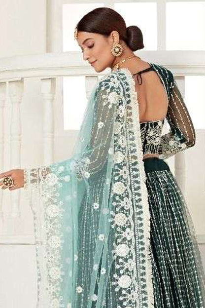 Close-Up Embroidery Detail On Green Bridal Lehenga Choli With Heavy Net Fabric