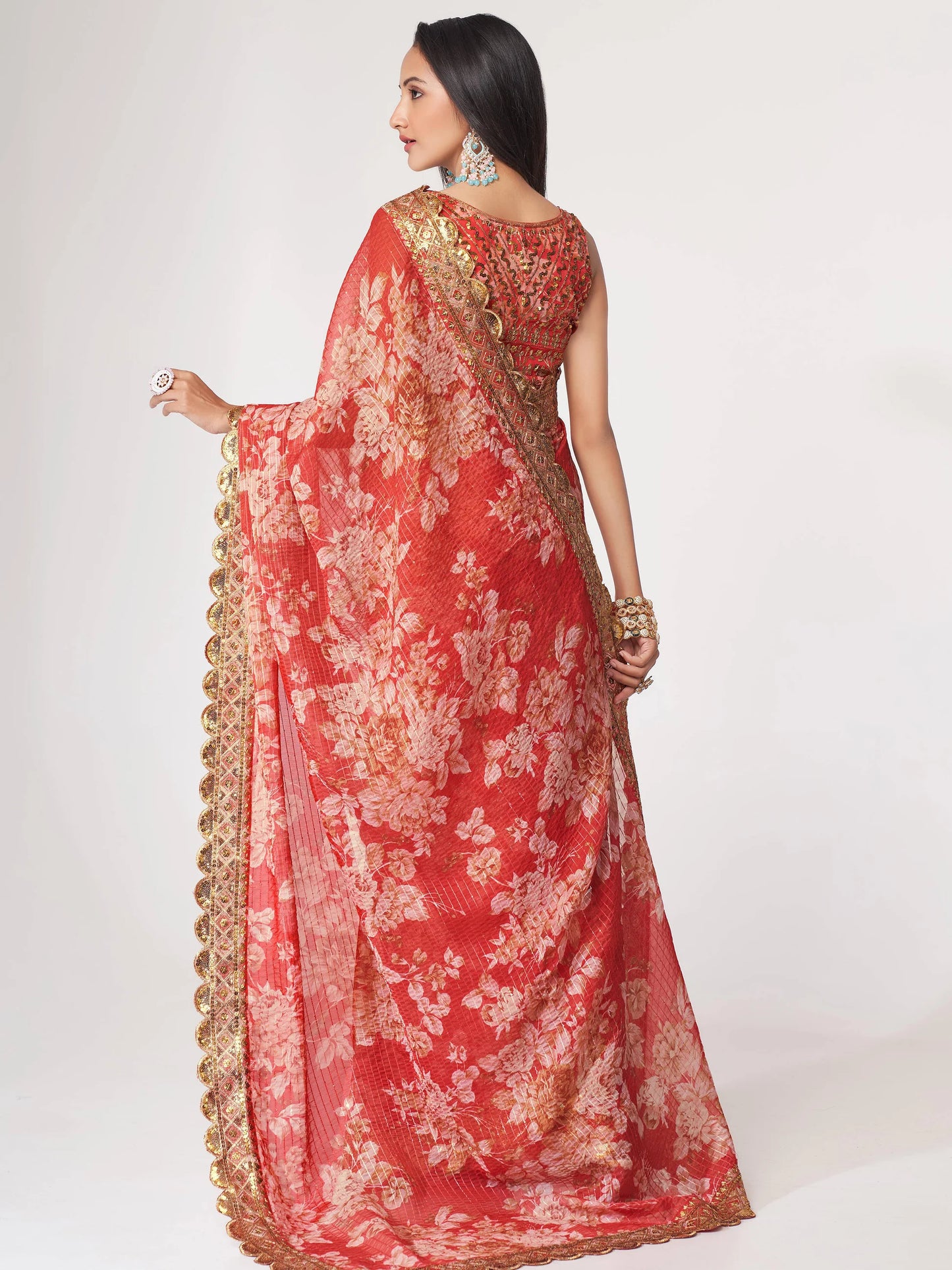 Red Saree speaks tradition and boldness – perfect for weddings and festive nights.
