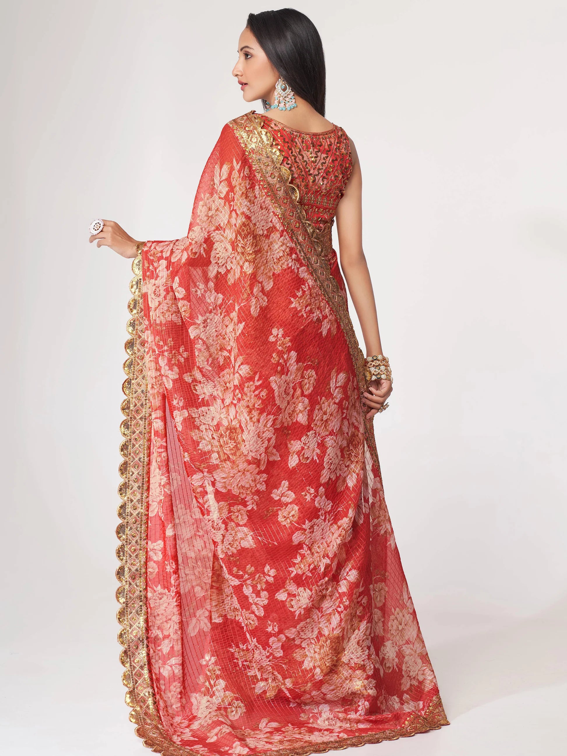 Red Saree speaks tradition and boldness – perfect for weddings and festive nights.
