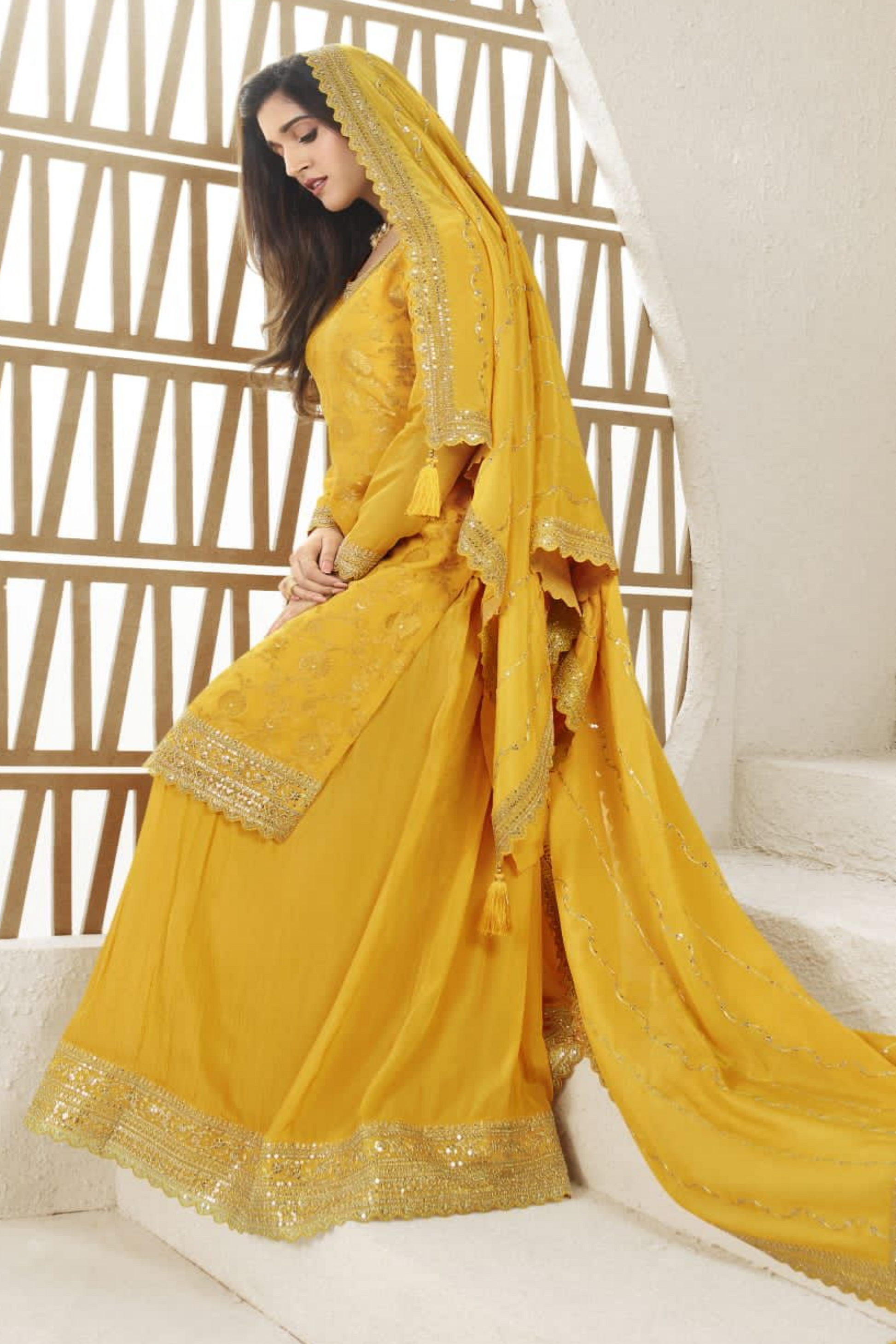A Woman Wearing  Yellow Indian Salwar Kameez Palazzo Dupatta Dress with Embroidery Work