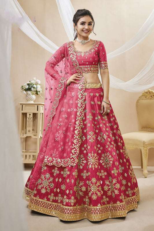 Pink bridal lehenga choli with embroidery for wedding reception.