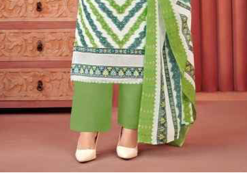 Green and white cotton outfit with a fresh, breezy feel, ideal for everyday comfort and casual festive wear.
