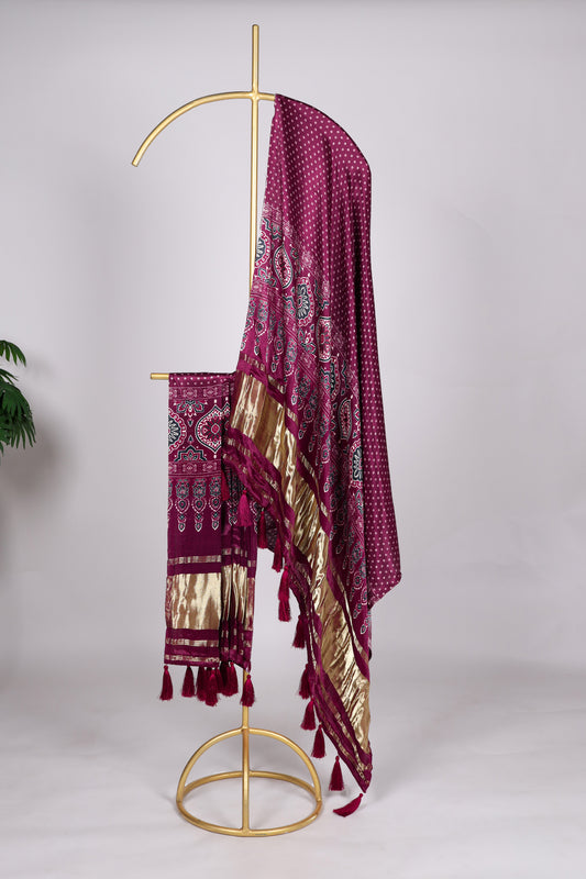 Wine color Gaji silk fabric with printed dupatta, enriched with deep-toned traditional patterns that add a luxurious and elegant touch to your salwar kameez attire.
