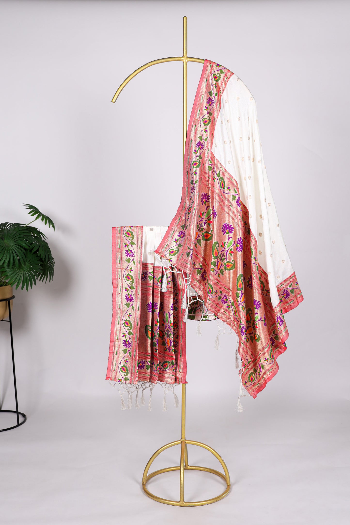 White color Gaji silk fabric with printed dupatta, adorned with elegant traditional designs that bring a pure and graceful touch to your salwar kameez outfit.

