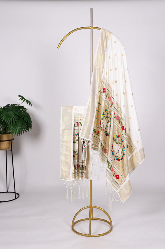 White and off-white color Gaji silk fabric with printed dupatta, featuring subtle traditional designs that add a serene and timeless elegance to your salwar kameez outfit.

