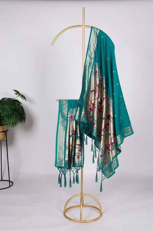 Teal blue color Gaji silk fabric with printed dupatta, adorned with elegant ethnic patterns that bring a refreshing and stylish touch to your salwar kameez ensemble.
