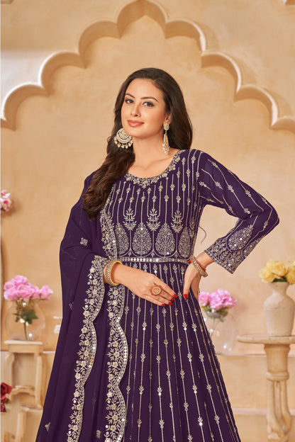 A Woman Modeling Purple Anarkali Dupatta Gown Suit With Embroidery Work