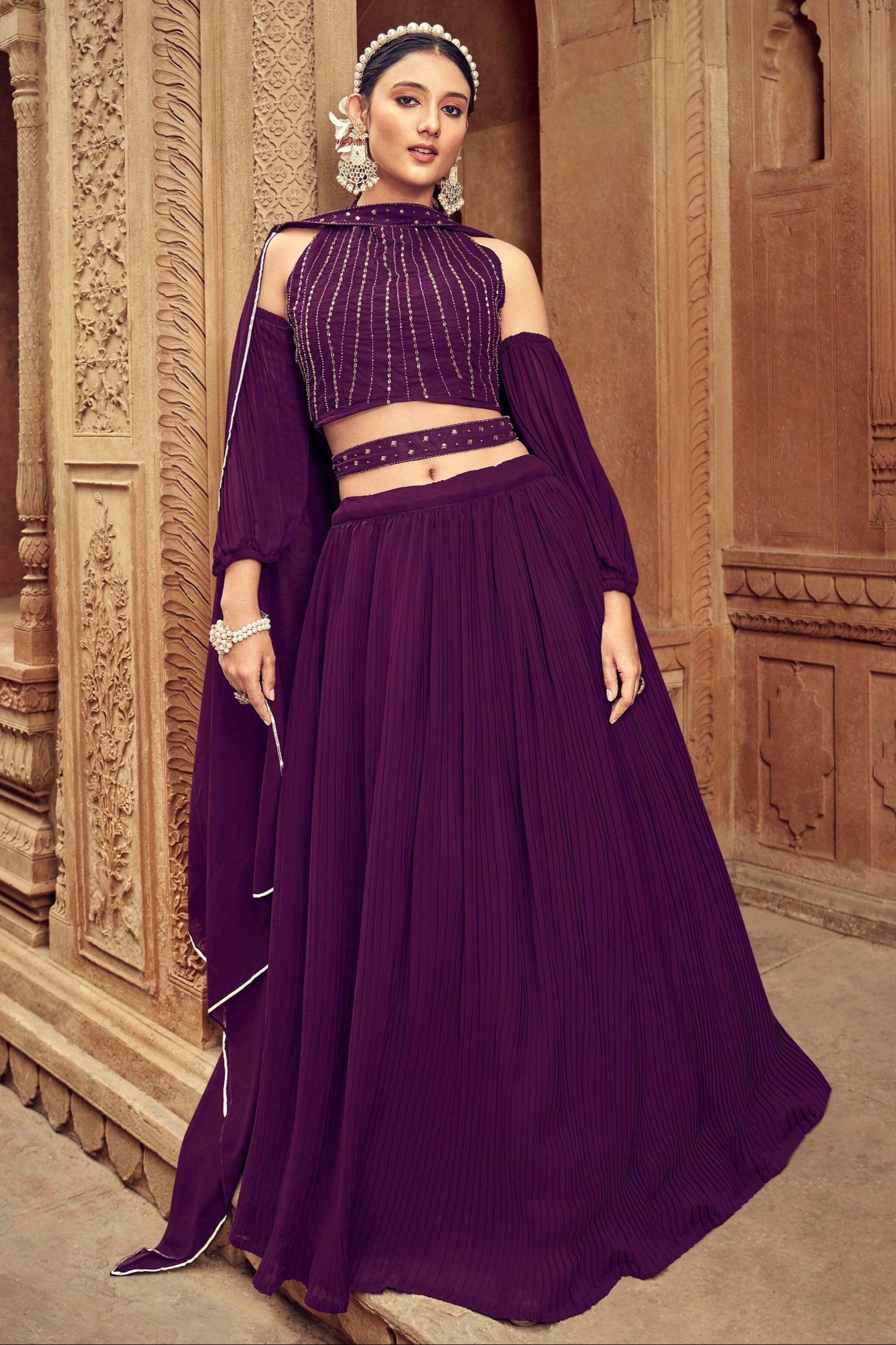 Purple bridal lehenga with net dupatta for wedding shoot in New