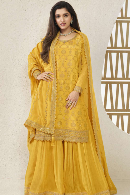 A Woman Wearing  Yellow Indian Salwar Kameez Palazzo Dupatta Dress with Embroidery Work