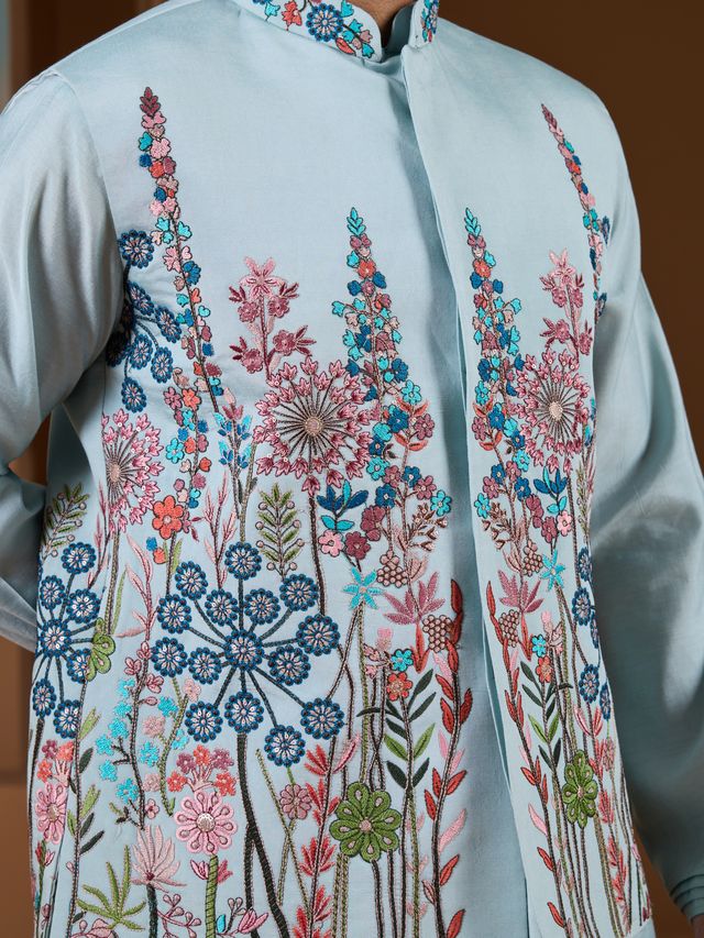 Traditional Sky Blue Silk Kurta For Men Featuring Designer Patterns, Suitable For Weddings And Parties.