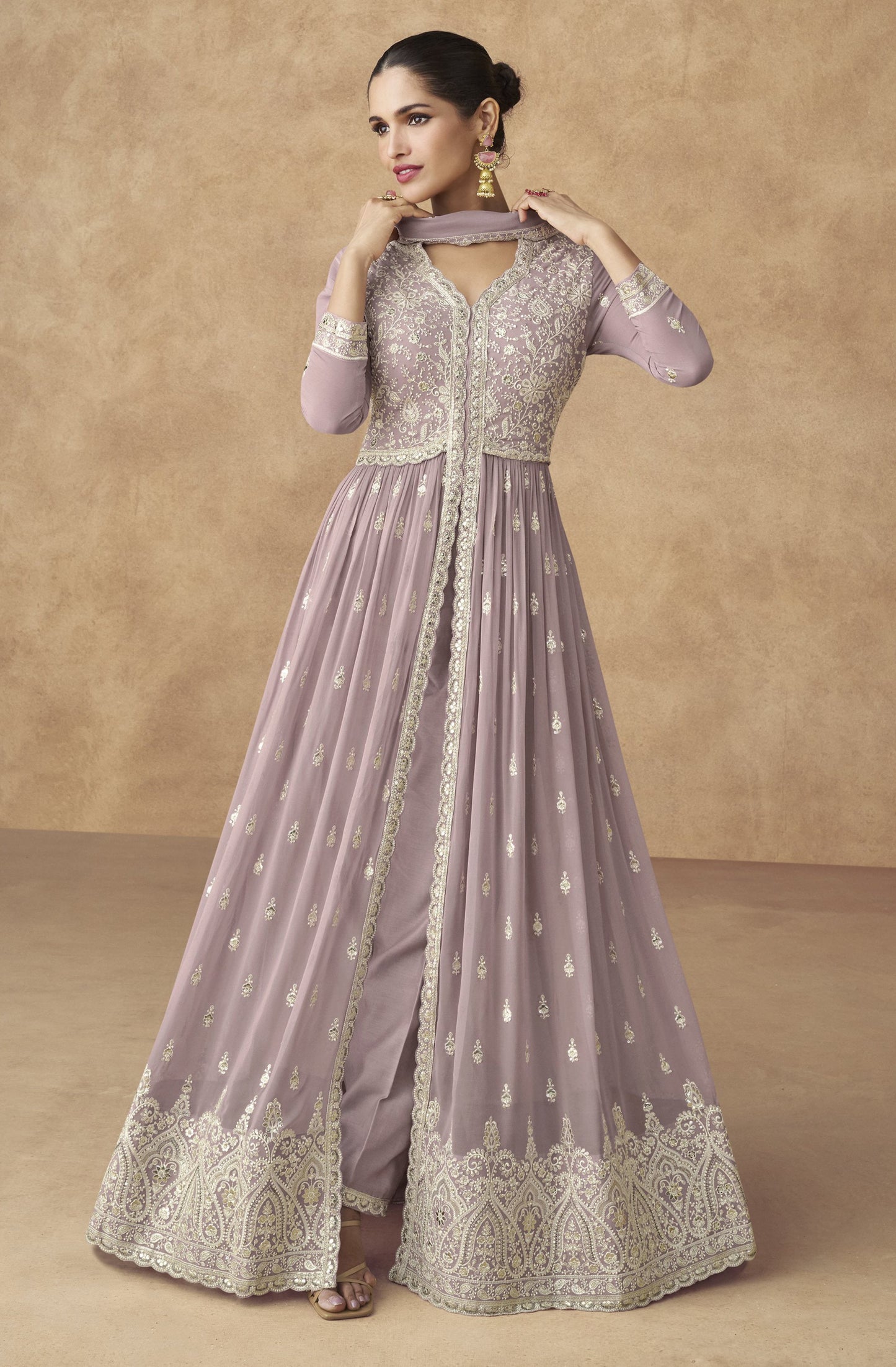 A Woman Modeling Traditional Lavender Anarkali Gown's