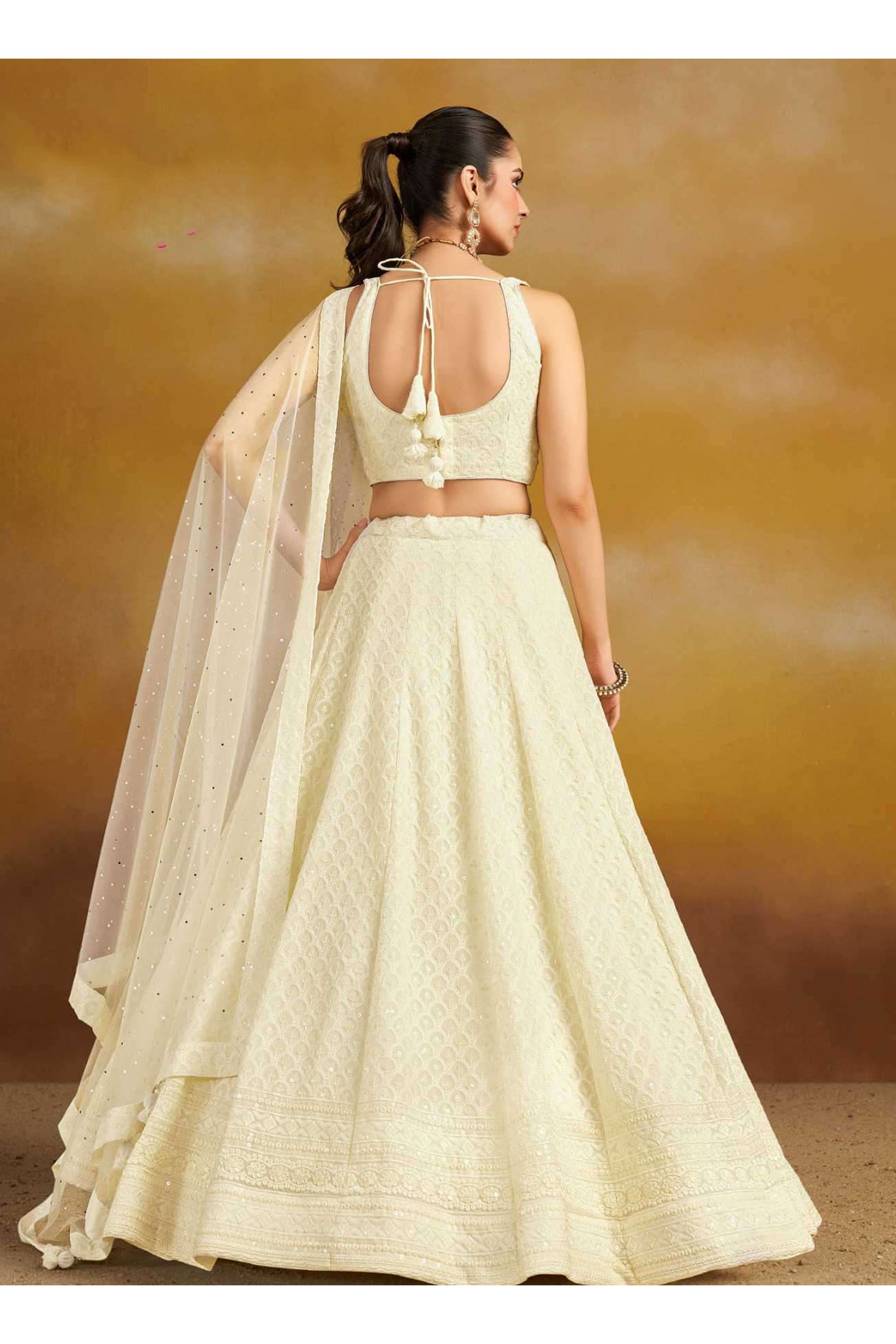 Close-Up Of Embroidered White Lehenga Choli Detailing With Sequins