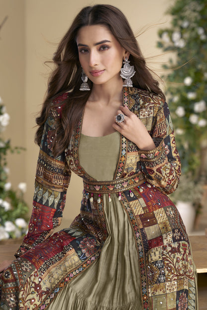 Sage green Indo-Western Anarkali gown in silk fabric with embellished work, offering a subtle yet stylish look for festive occasions.
