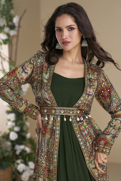 Dark green Indo-Western Anarkali gown in silk fabric with embellished work, showcasing a regal and graceful festive look.
