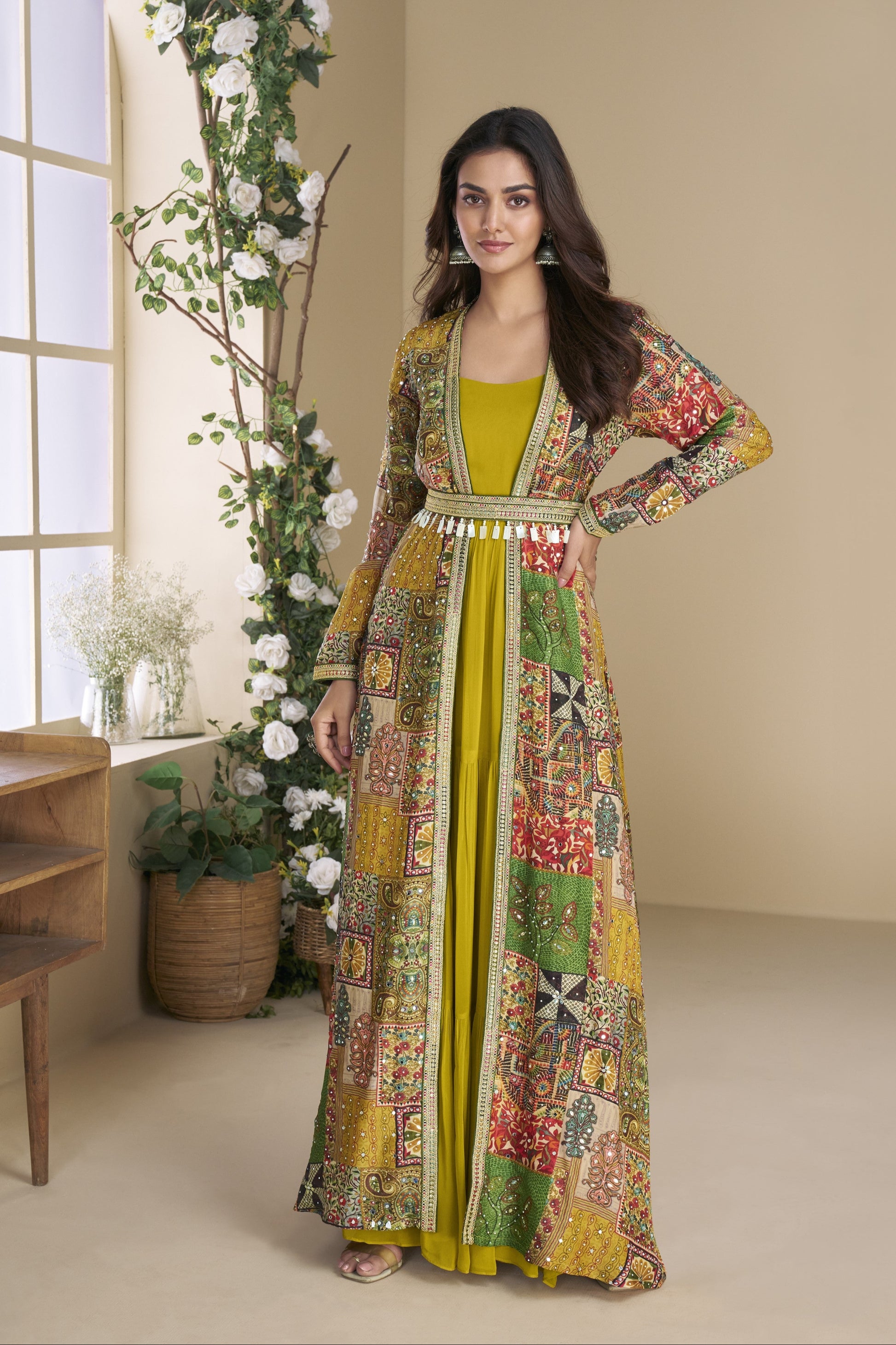 Dark yellow Indo-Western Anarkali gown in silk fabric with embellished work, combining vibrant charm with festive elegance.
