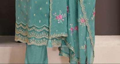 Teal salwar kameez is cool and refreshing. It blends blue and green for a unique look