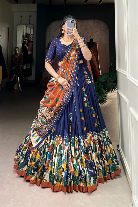 Navy blue Tussar silk lehenga with Kalamkari print work, blending traditional art with elegant festive style.
