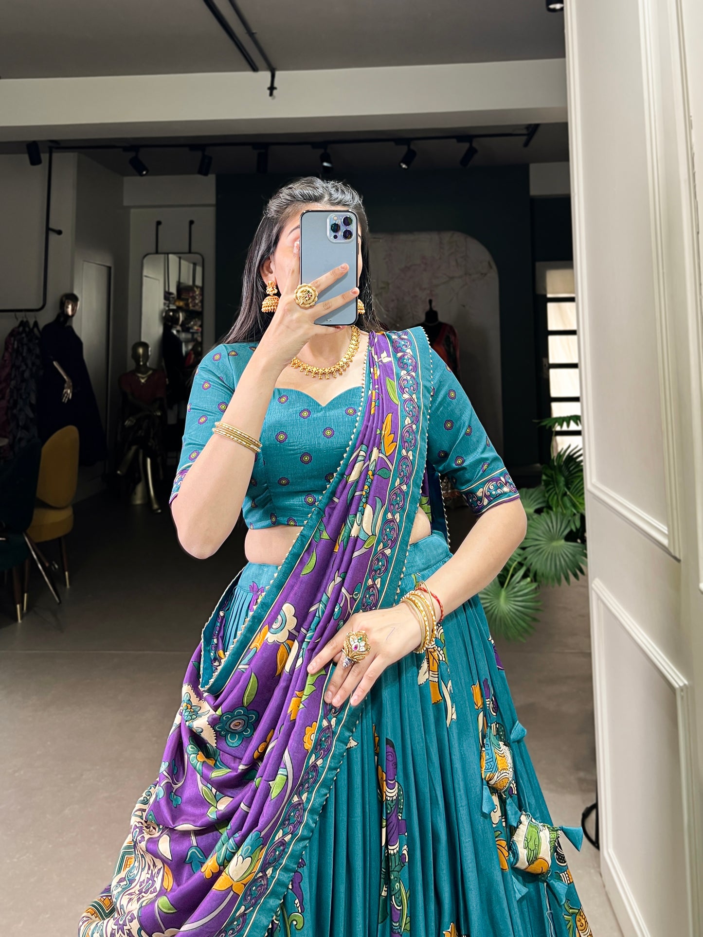 Blue Tussar silk lehenga with Kalamkari print work, featuring artistic patterns that add a graceful touch to festive wear.
