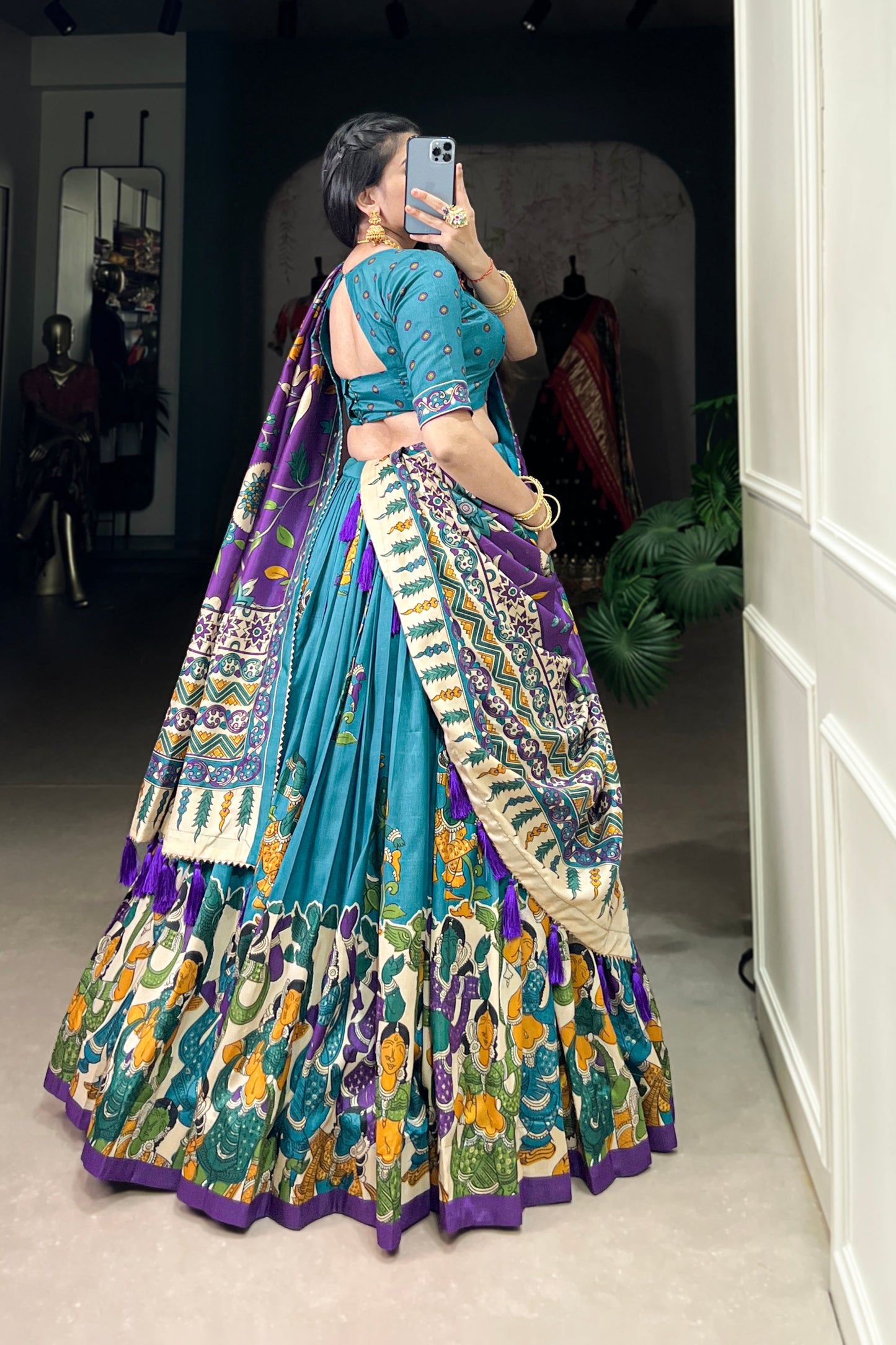 Blue Tussar silk lehenga with Kalamkari print work, featuring artistic patterns that add a graceful touch to festive wear.
