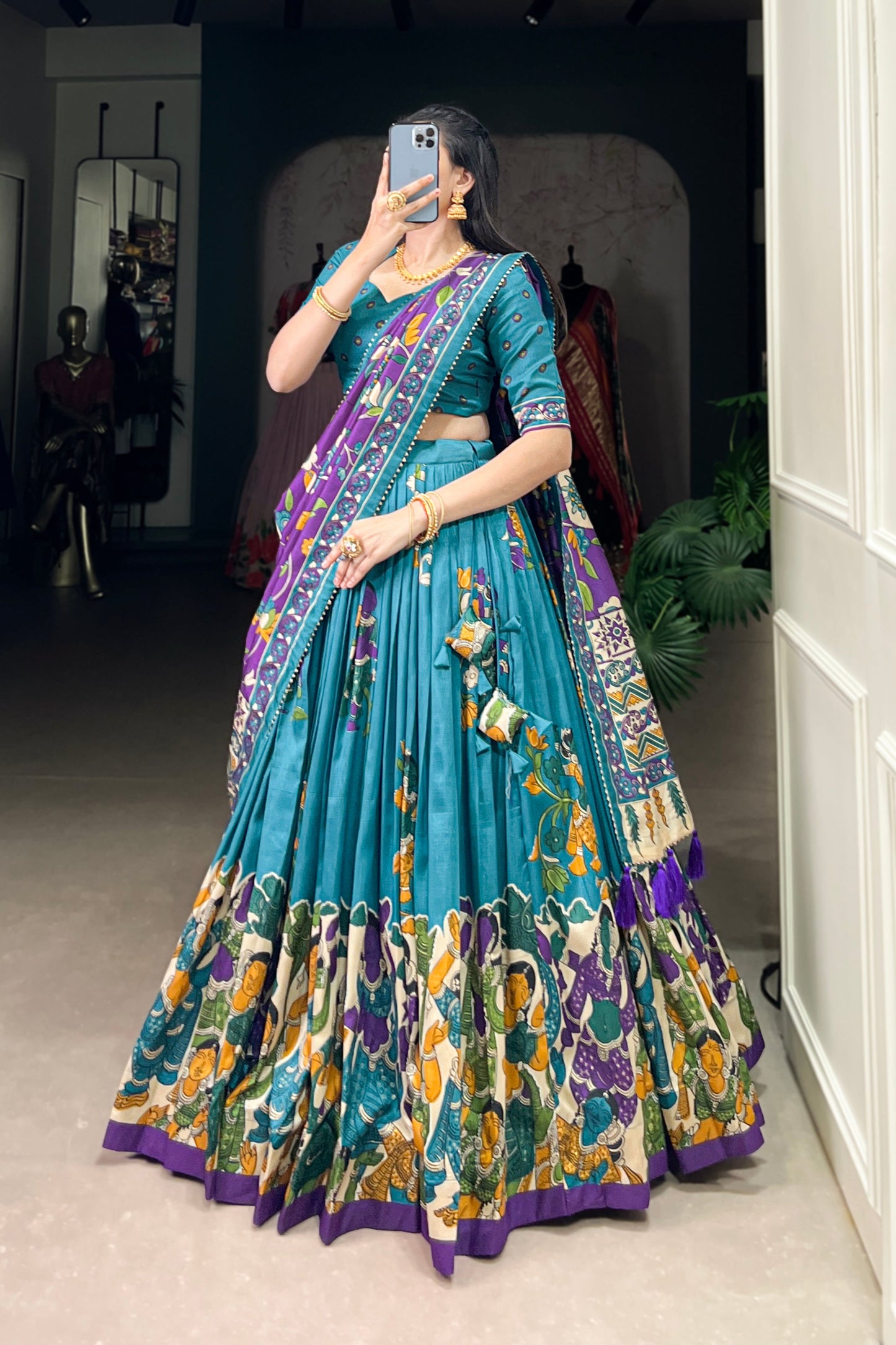 Blue Tussar silk lehenga with Kalamkari print work, featuring artistic patterns that add a graceful touch to festive wear.
